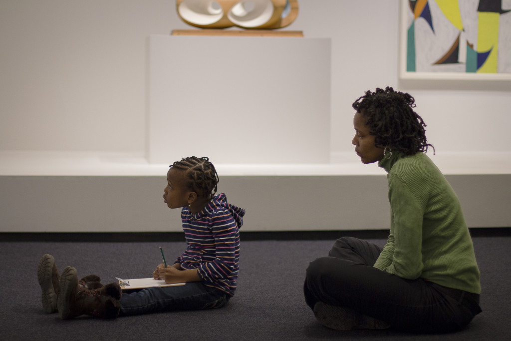 A quiet moment at the Hirshhorn while a child sketches.